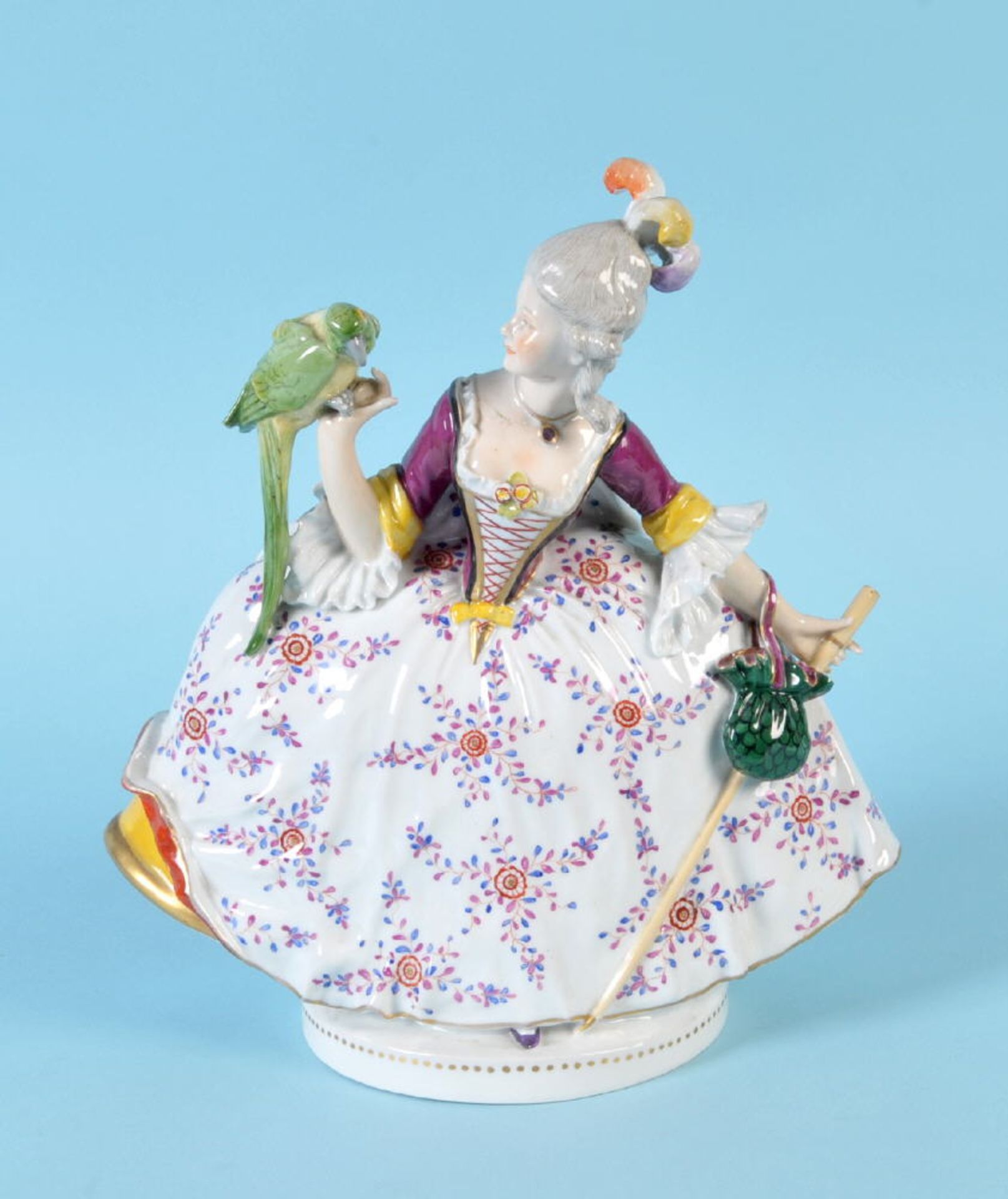 Figur - Dame mit PapageiPorzellan, farbig gefasst, auf rundem Sockel, H= 30 cm, Modell-Nr. 1337,