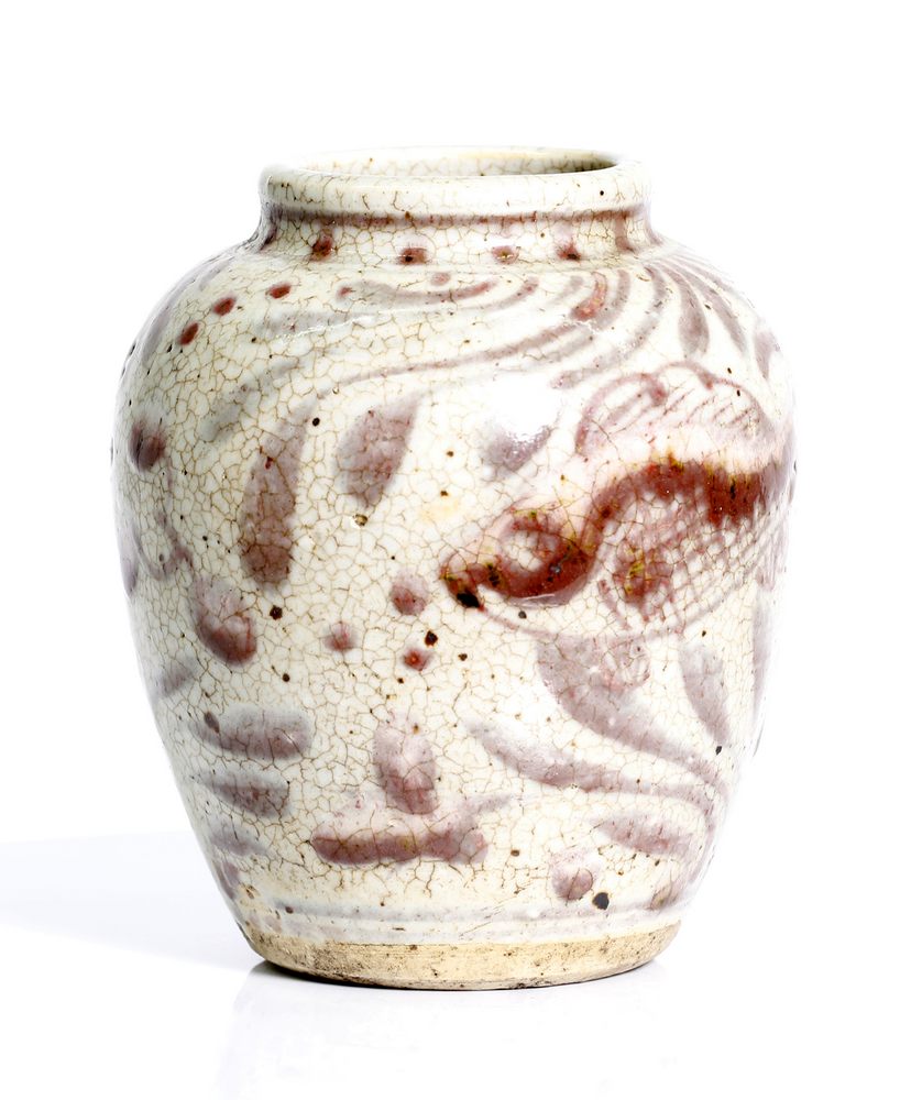 an antique, Chinese, stonewear vase with red over glaze.