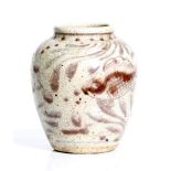 an antique, Chinese, stonewear vase with red over glaze.