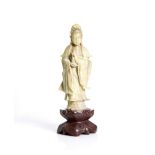 an antique, Chinese, soapstone Guanyin.