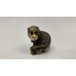 a bone netsuke of a monkey Japan 1900's signed