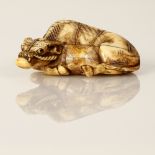 reclining bull netsuke signed Tomotada 19 c. Meiji Japan