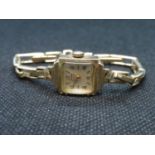 Lady's 9ct gold watch with plated strap