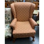 Wing backed armchair