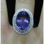 Lady's 18ct white gold amethyst and diamond cluster ring half carat of diamonds