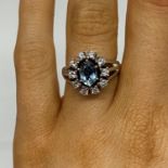 14ct white gold aquamarine and diamond cluster ring set with 10 brilliant cut diamonds diamond .