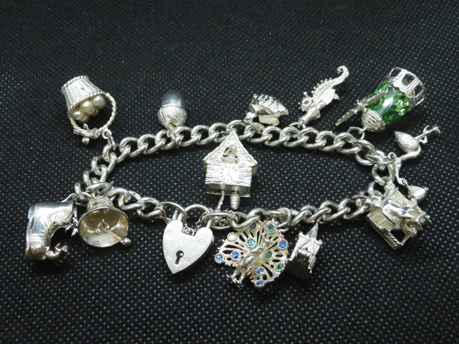 Vintage silver charm bracelet reach link stamped Lion Passant fully HM Birmingham 1971 11 charms