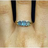 Lady's Victorian hoop ring set with 3 oval aquamarine and 4 small diamonds 9ct