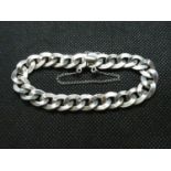 Silver curb link bracelet with slide fastener