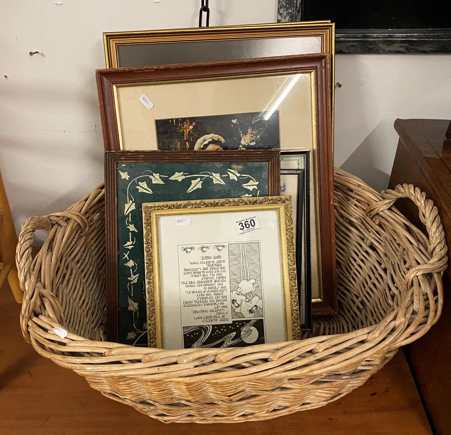 Collection of pictures and maps in wicker basket