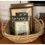 Collection of pictures and maps in wicker basket