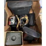 Box of 35mm cameras and binoculars