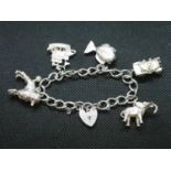 vintage silver charm bracelet with 5 large silver charms London 1976 43g