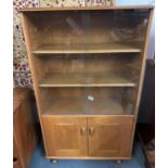 Ercol unit with glass fronted shelves 53" high