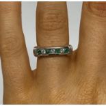 Beautiful 18ct gold emerald and diamond eternity ring set with 4 emeralds and three brilliant cut
