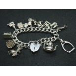 Heavy quality vintage charm bracelet with 13 charms London 1976 78g