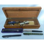 Fine wooden box containing fountain pens