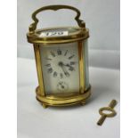 Chiming French carriage clock with key fully working side glass damaged