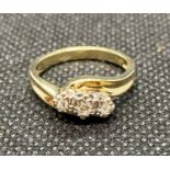 9ct gold ring illusion set with 3 diamonds in crossover style