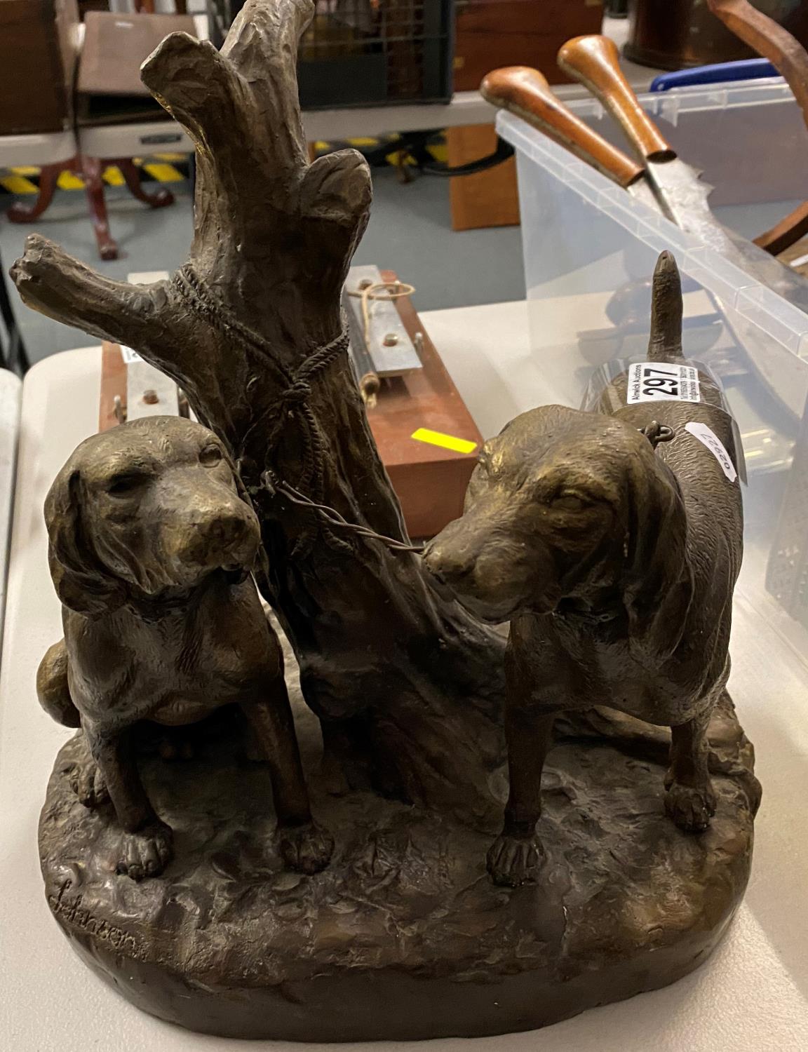 Heavy bronze hunting dogs singed by Johnson