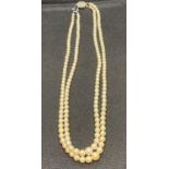 Fine quality double row of graduated cultured pearls in fitted case