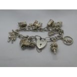 Vintage silver charm bracelet with 11 charms London 1976 38g