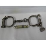 Set of original old handcuffs with key and metropolitan patent GPO whistle