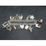 Vintage silver charm bracelet with 13 charms Shefflied 1974