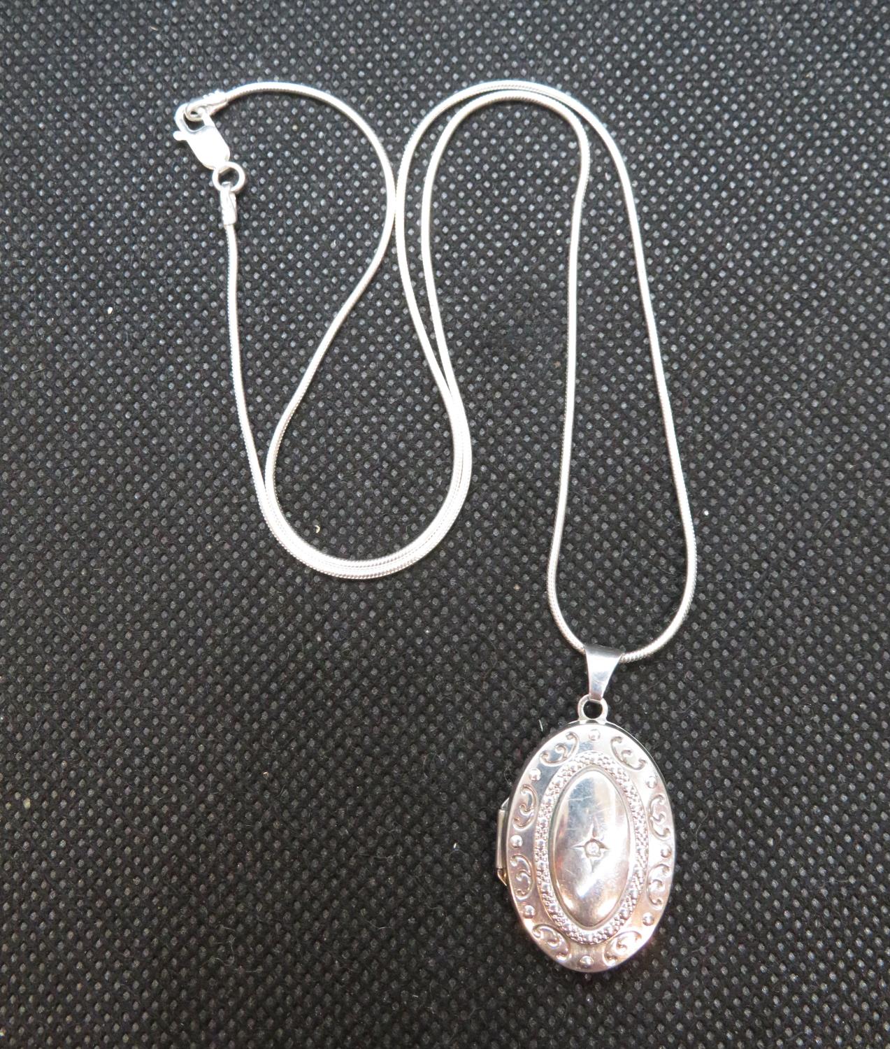 Diamond set silver locket on 18" silver chain 7g