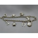 Modern silver charm bracelet with 8x cute charms fully HM 12g