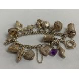 Vintage silver bracelet with patented padlock with 15 rare charms Birmingham 1976 76g