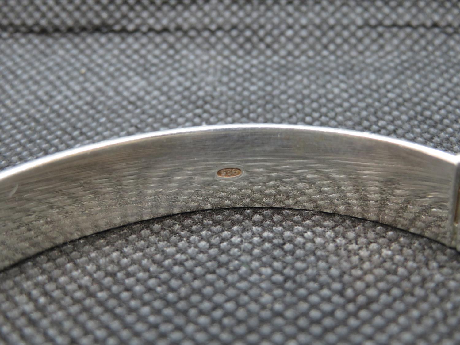 Solid silver bangle with unique tension fastener and diamond cut pattern 19.5g - Image 2 of 2