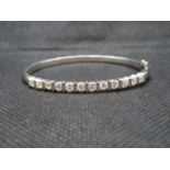 HM 750 white gold by HJ bangle with 12x .3ct brilliant cut diamonds - total weight of 18.2g