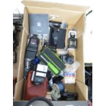 Box of photographic equipment with Apple charger and DVD drive and SIEKO model L325 light meter and