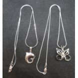 Butterfly pendant on silver serpentine chain and dolphin pendant on serpentine chain