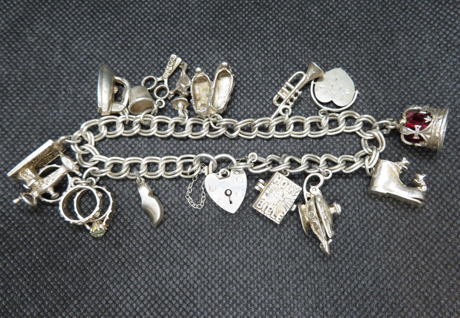 Vintage silver charm bracelet with 13 charms Sheffield 1974