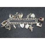 Vintage silver charm bracelet with 13 charms Sheffield 1974