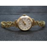 Boxed ladies 9ct gold Tudor Rolex watch with rolled gold strap runs but needs attention