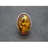 Large silver ring set with Baltic amber