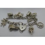 Vintage silver charm bracelet with 11 charms London 1976 38g