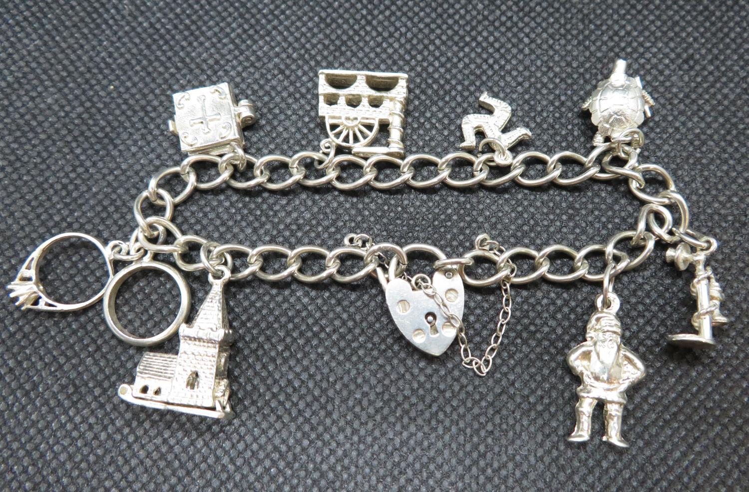 Vintage silver charm bracelet with 8 charms Birmingham 1979 27.5g