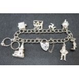 Vintage silver charm bracelet with 8 charms Birmingham 1979 27.5g