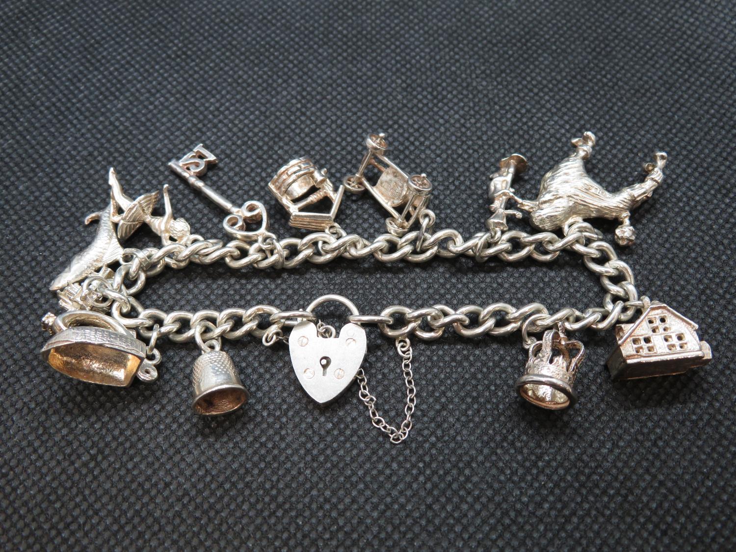 Silver charm bracelet with 12 charms Birmingham 1973 49g