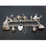 Silver charm bracelet with 12 charms Birmingham 1973 49g