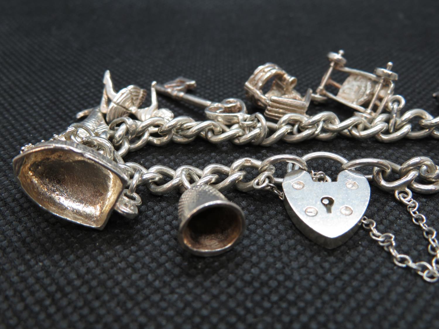 Silver charm bracelet with 12 charms Birmingham 1973 49g - Image 2 of 2