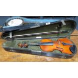 Old full back violin in old sarcophagus case with bow