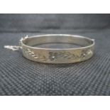 Solid silver bangle with unique tension fastener and diamond cut pattern 19.5g