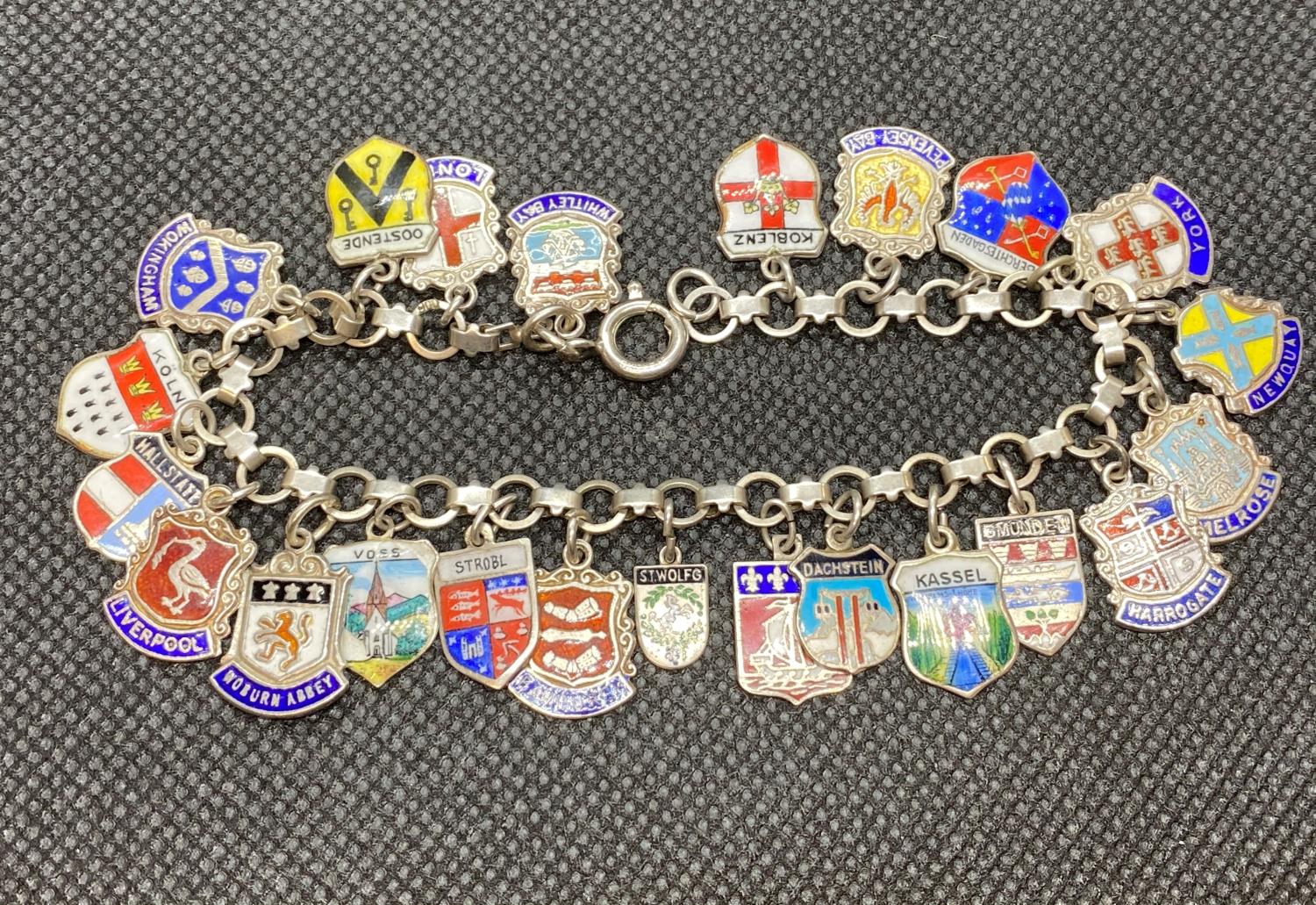 Foreign silver (800 grade) bracelet with 23 charms and enamel souvenir charms 30g