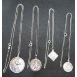 4x silver St. Christopher medallions on varying lengths of chain