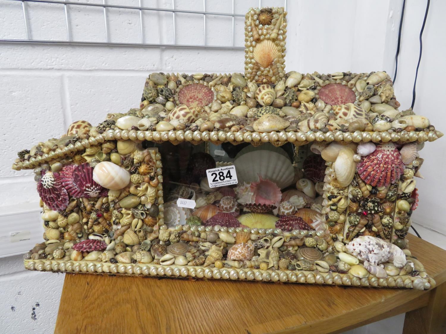 Large 2' x 1' house made of shells with glass grotto interior